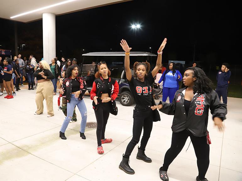 Students participate in a stroll off under the Student Union overhang during Homecoming.